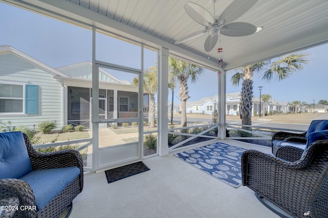 sunroom / solarium featuring ceiling fan