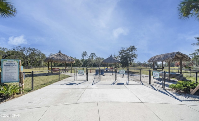 surrounding community with a gazebo and a lawn