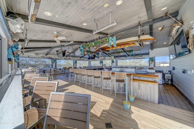 wooden deck featuring an outdoor bar