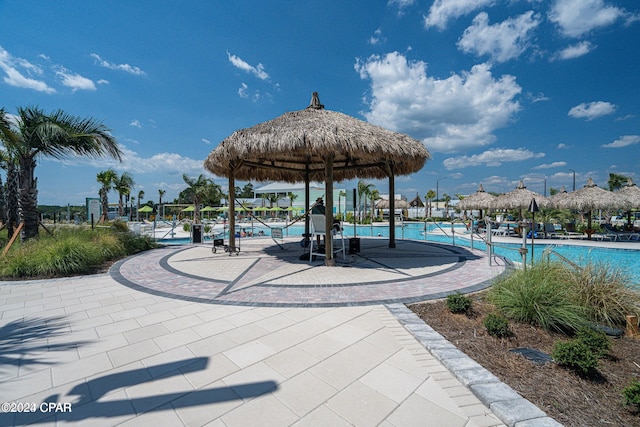 view of community featuring a gazebo, a pool, and a patio