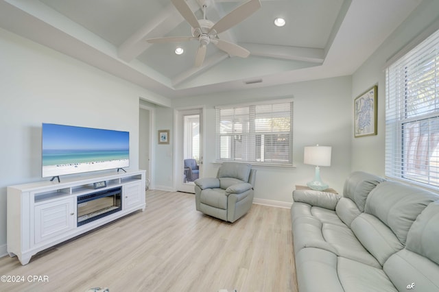 living room featuring beamed ceiling, ceiling fan, and light hardwood / wood-style floors