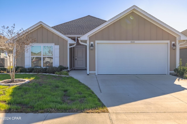 ranch-style house with a garage and a front yard