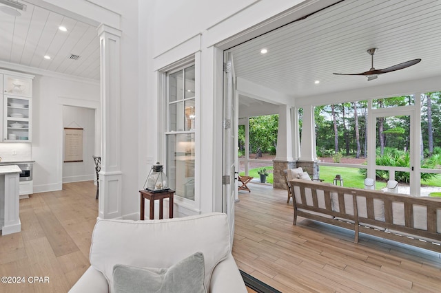 interior space with ceiling fan