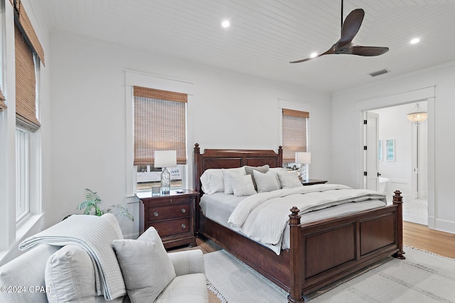 bedroom with light wood-type flooring, ceiling fan, and wooden ceiling