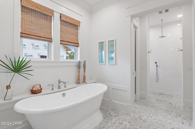 bathroom with crown molding and plus walk in shower