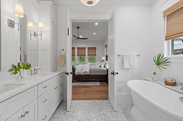 bathroom with vanity and a bathing tub