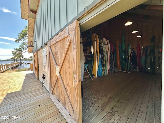 view of horse barn featuring a water view