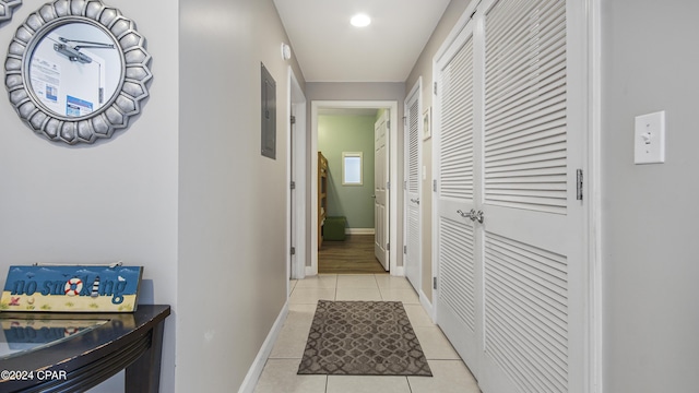 hallway featuring light tile patterned flooring