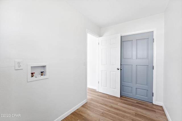 washroom featuring washer hookup and light hardwood / wood-style floors