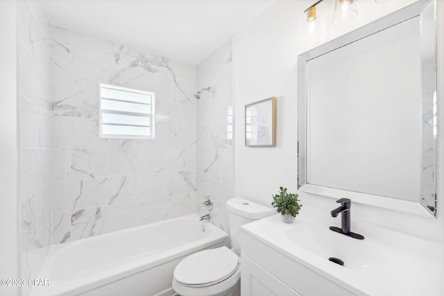 full bathroom featuring tiled shower / bath combo, toilet, and vanity