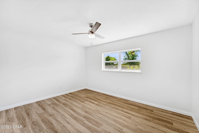 spare room featuring ceiling fan and light hardwood / wood-style flooring