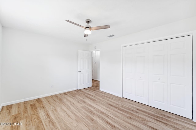 unfurnished bedroom featuring a closet, ceiling fan, and light hardwood / wood-style floors