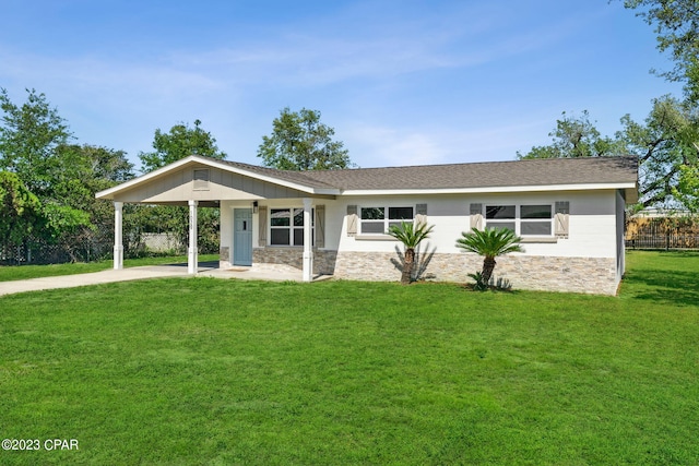 ranch-style home with a carport and a front lawn