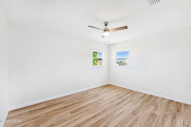 spare room featuring ceiling fan and light hardwood / wood-style floors