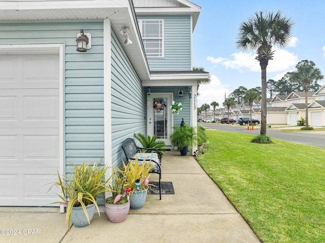 entrance to property with a yard