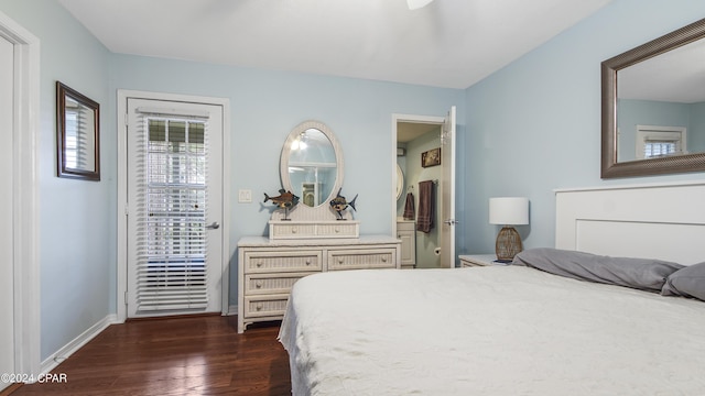 bedroom featuring dark wood-type flooring and baseboards