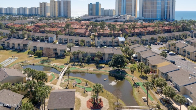 birds eye view of property featuring a water view and a view of city