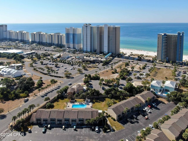 drone / aerial view featuring a view of city and a water view