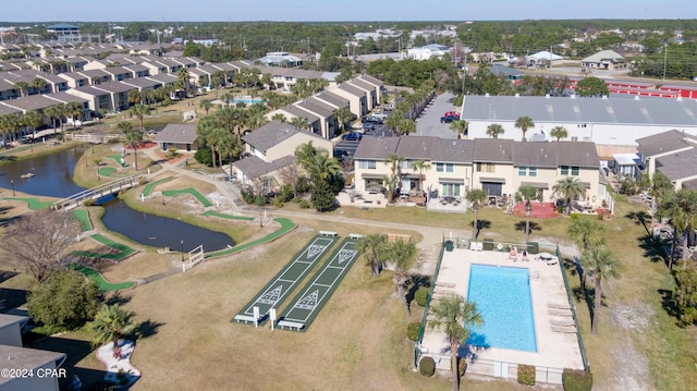 bird's eye view with a residential view and a water view