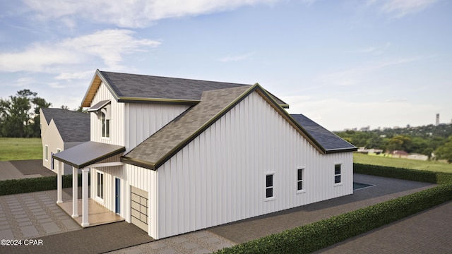 view of side of home featuring a garage