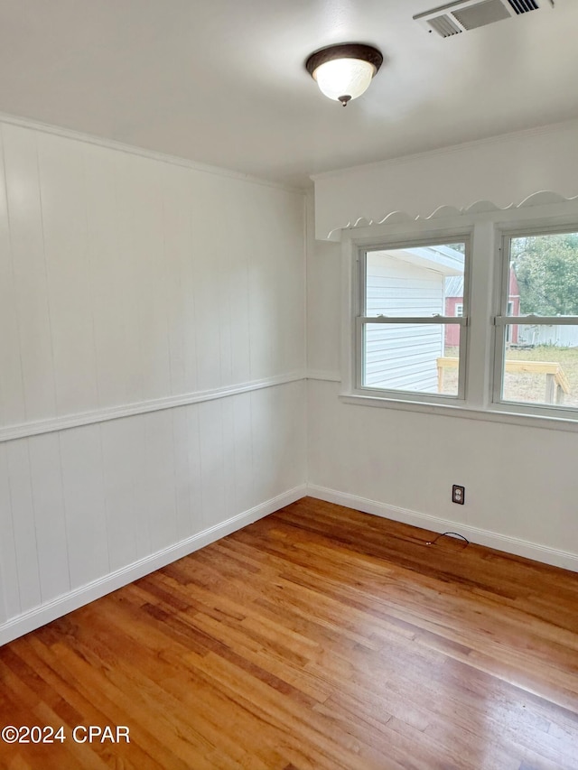 empty room featuring hardwood / wood-style flooring