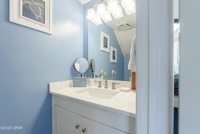 bathroom featuring visible vents and vanity