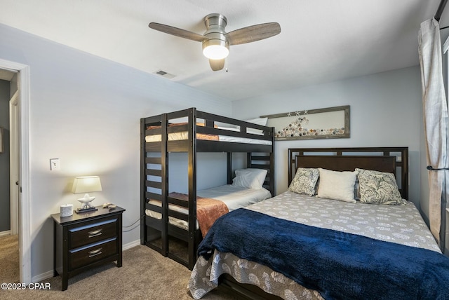 bedroom featuring baseboards, visible vents, ceiling fan, and light colored carpet