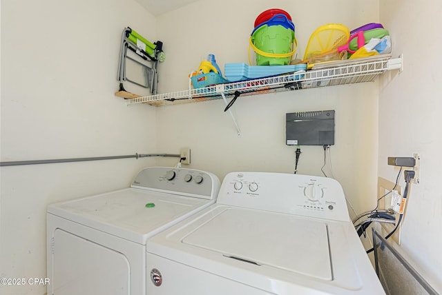 clothes washing area with laundry area and washing machine and dryer