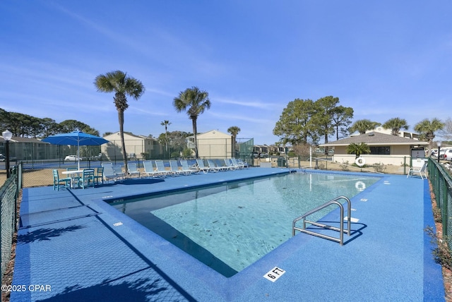 community pool featuring fence