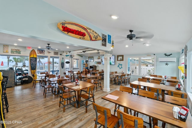 dining room featuring recessed lighting, a wall mounted air conditioner, ceiling fan, and wood finished floors