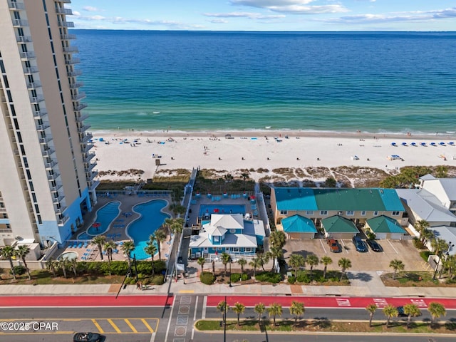 bird's eye view with a beach view and a water view