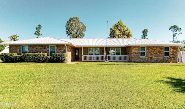 ranch-style house featuring a front lawn