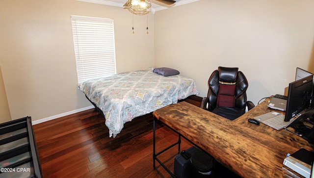 bedroom featuring ceiling fan, ornamental molding, and dark hardwood / wood-style floors