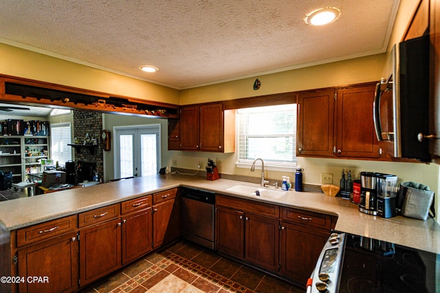 kitchen featuring appliances with stainless steel finishes, kitchen peninsula, french doors, a textured ceiling, and sink