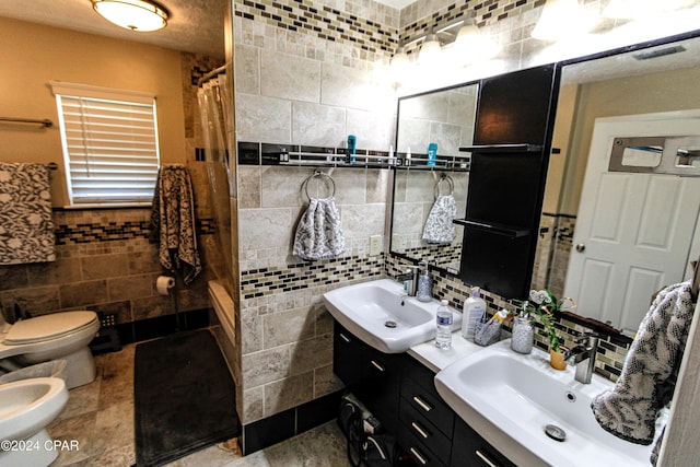 bathroom featuring tile walls, a bidet, tasteful backsplash, and vanity