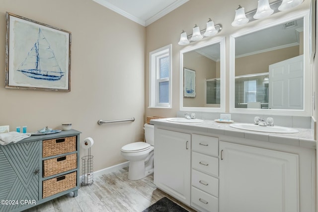 313 Laureno Pl, Panama City Beach, FL 32413 - bathroom featuring hardwood / wood-style flooring, vanity, an enclosed shower, ornamental molding, and toilet