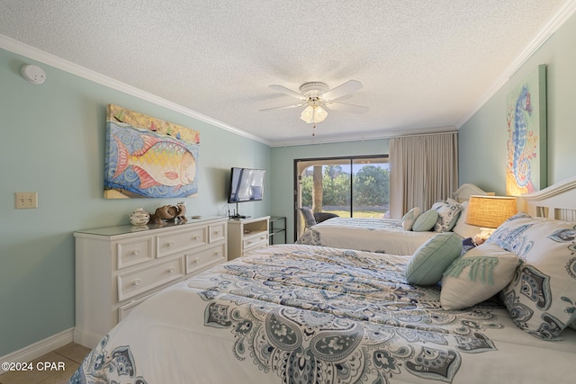 bedroom featuring ceiling fan, access to exterior, and a textured ceiling