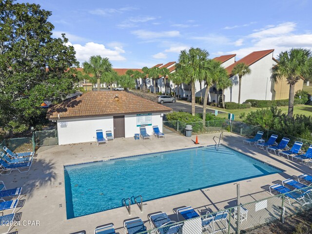 view of swimming pool with a patio area