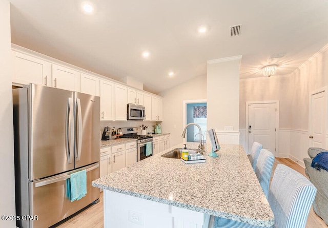 kitchen featuring white cabinets, sink, and appliances with stainless steel finishes