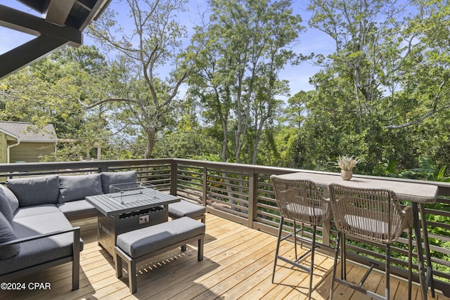 deck featuring outdoor lounge area