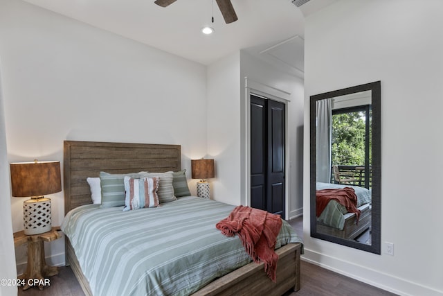 bedroom with a closet, ceiling fan, and dark hardwood / wood-style floors