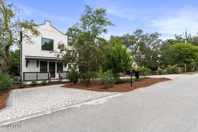 view of front of property with central AC and covered porch