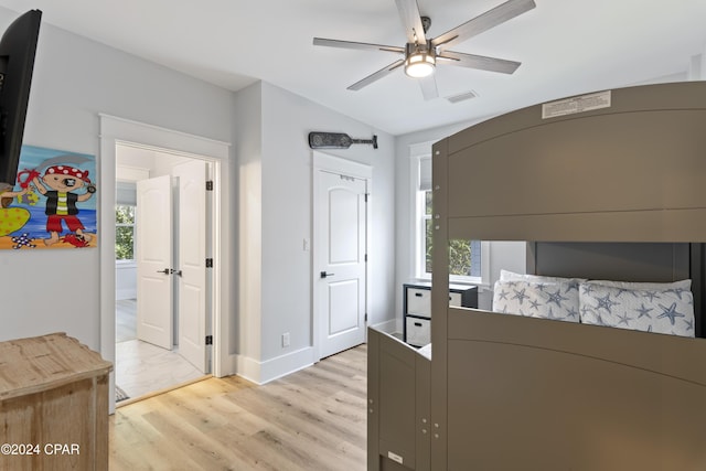 bedroom featuring light hardwood / wood-style floors and ceiling fan