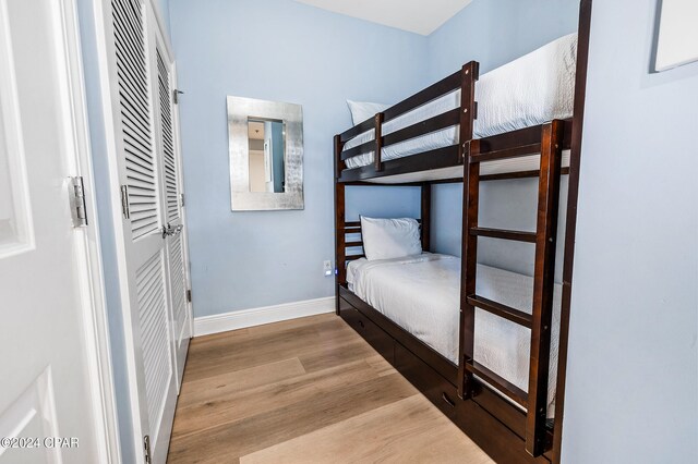 bedroom with hardwood / wood-style floors