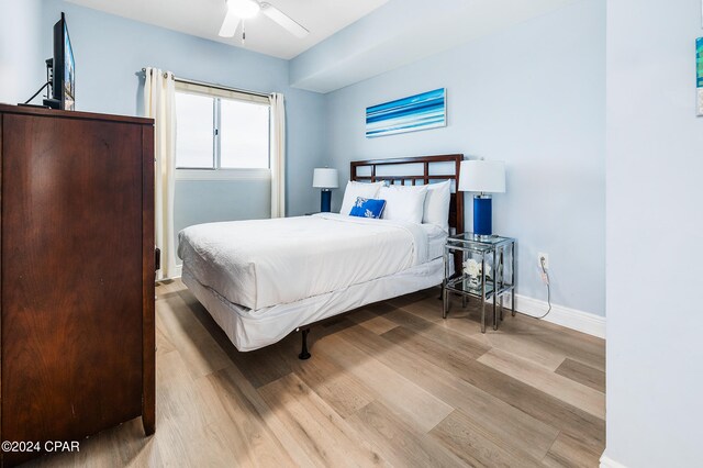 bedroom featuring ceiling fan and light wood-type flooring