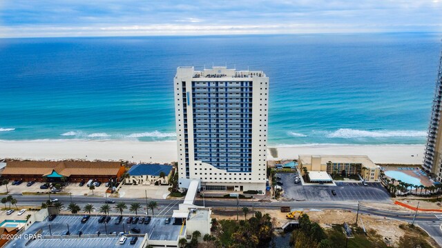 drone / aerial view featuring a view of the beach and a water view