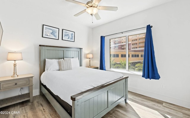 bedroom featuring light wood-type flooring and ceiling fan