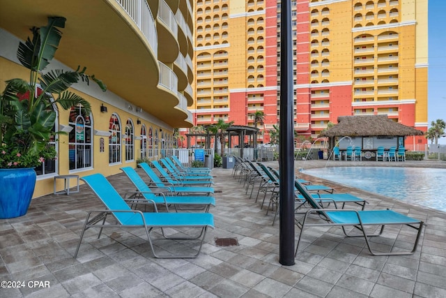 exterior space featuring pool water feature and a community pool