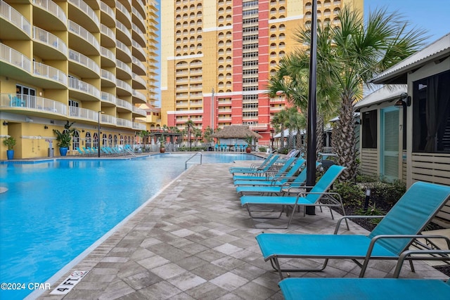 view of swimming pool with a patio