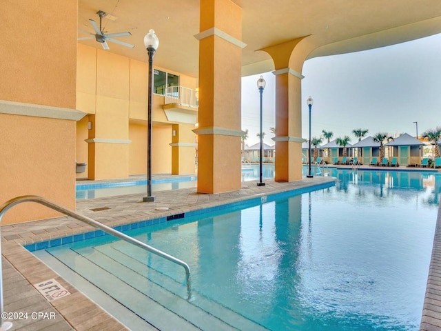 view of pool featuring ceiling fan